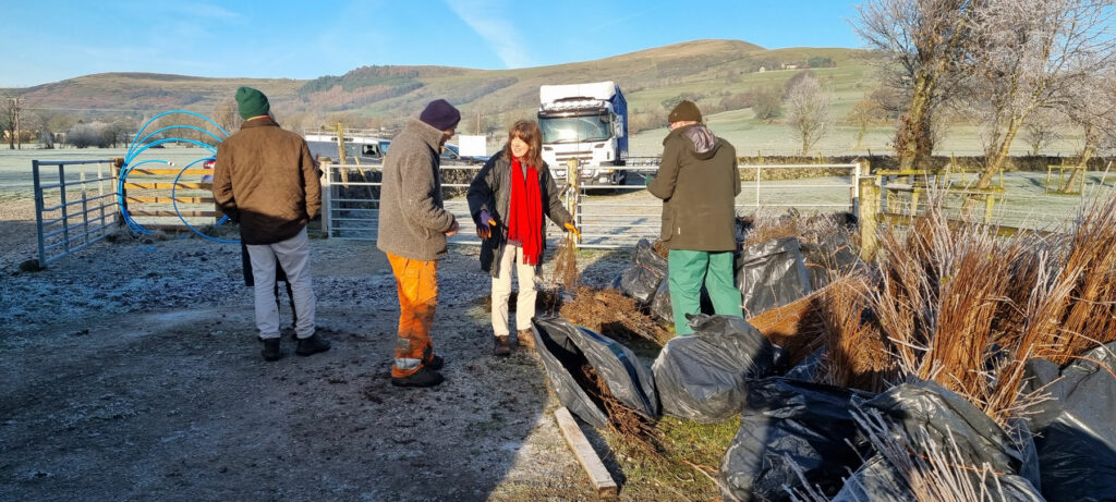 Hedgerow expert Jasper Prachek gives advice to Hope Valley farmer Denise Matthews as she prepares for planting on her farm.